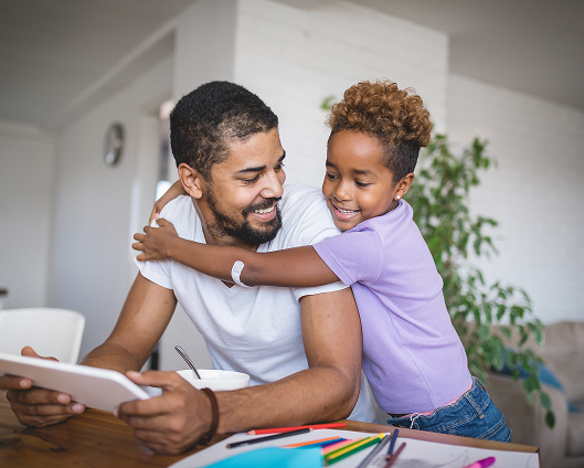 A father and her child enjoying family time together.