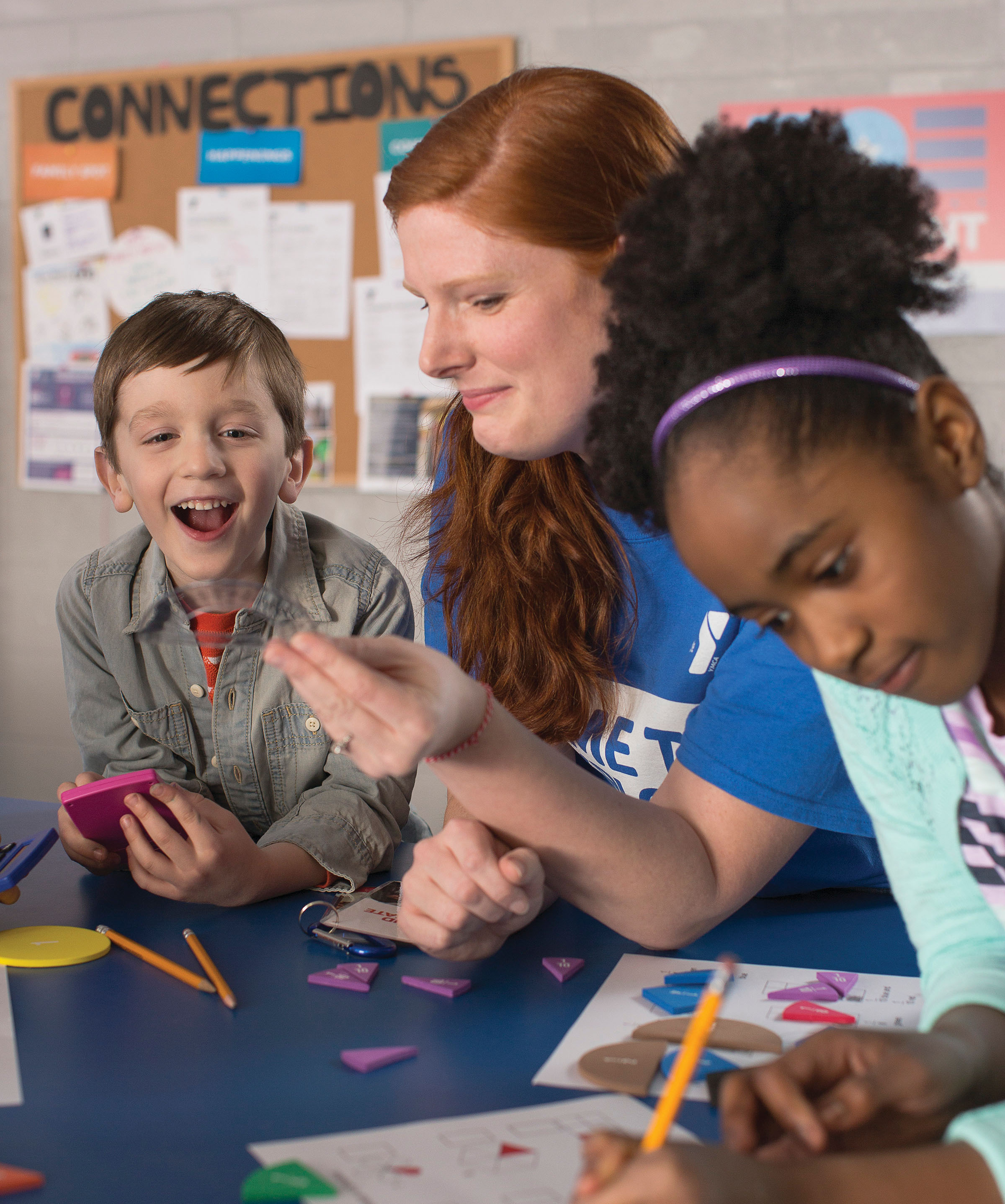 Teacher with children doing classwork