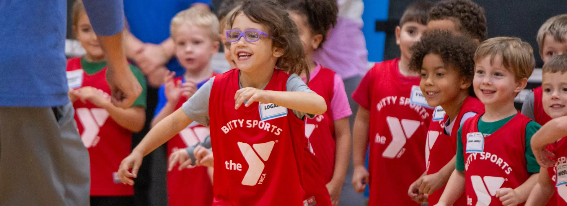 Children in YMCA sports jerseys